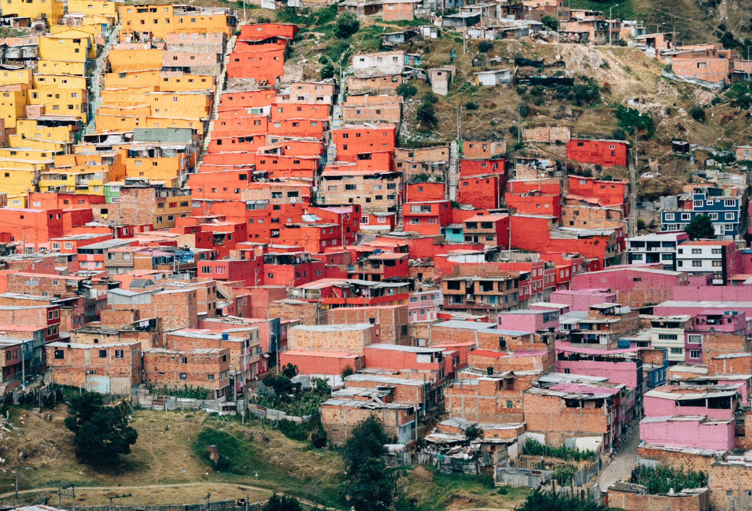 View of colourful houses sprawling up a hill