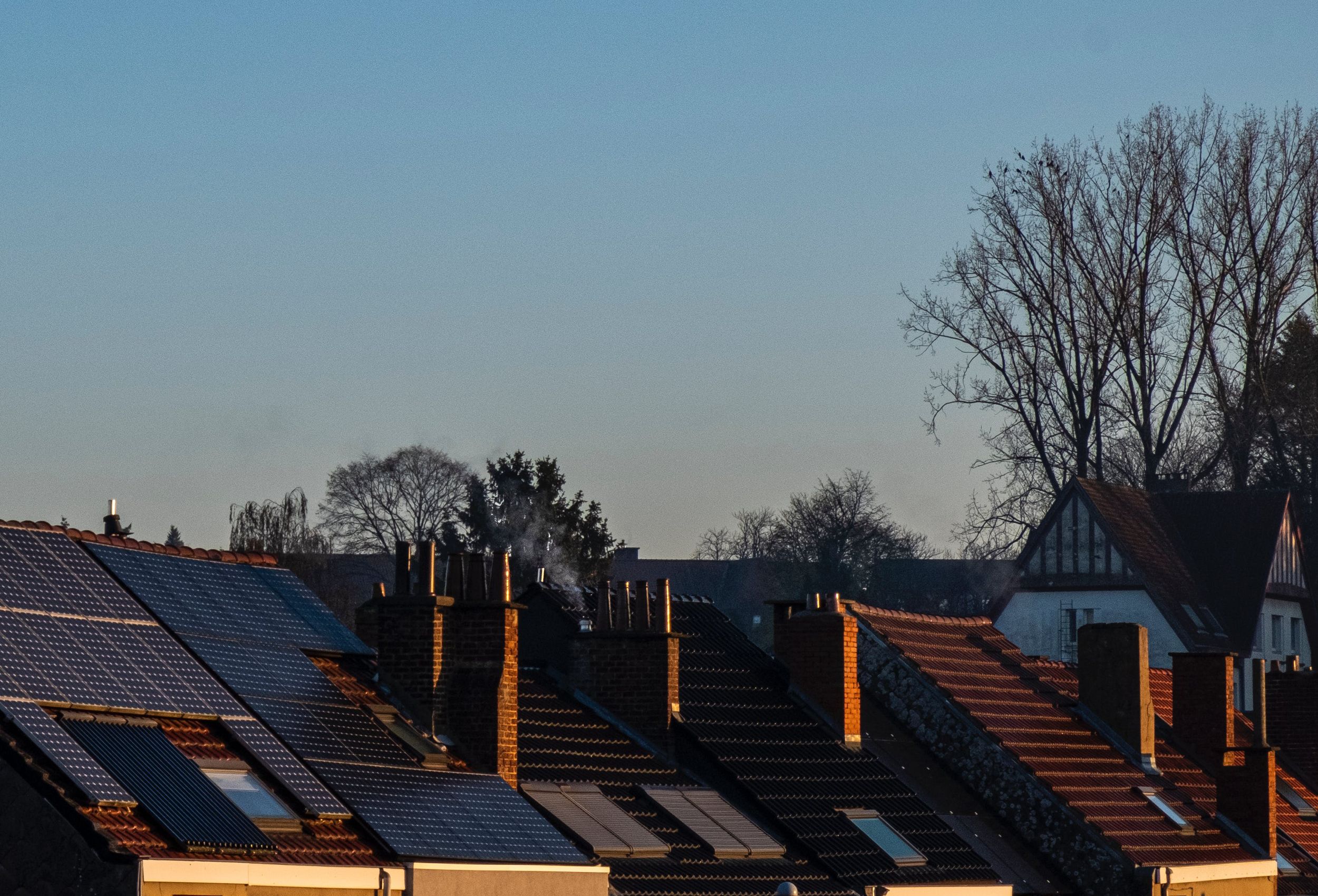 Row of house roofs with solar panels