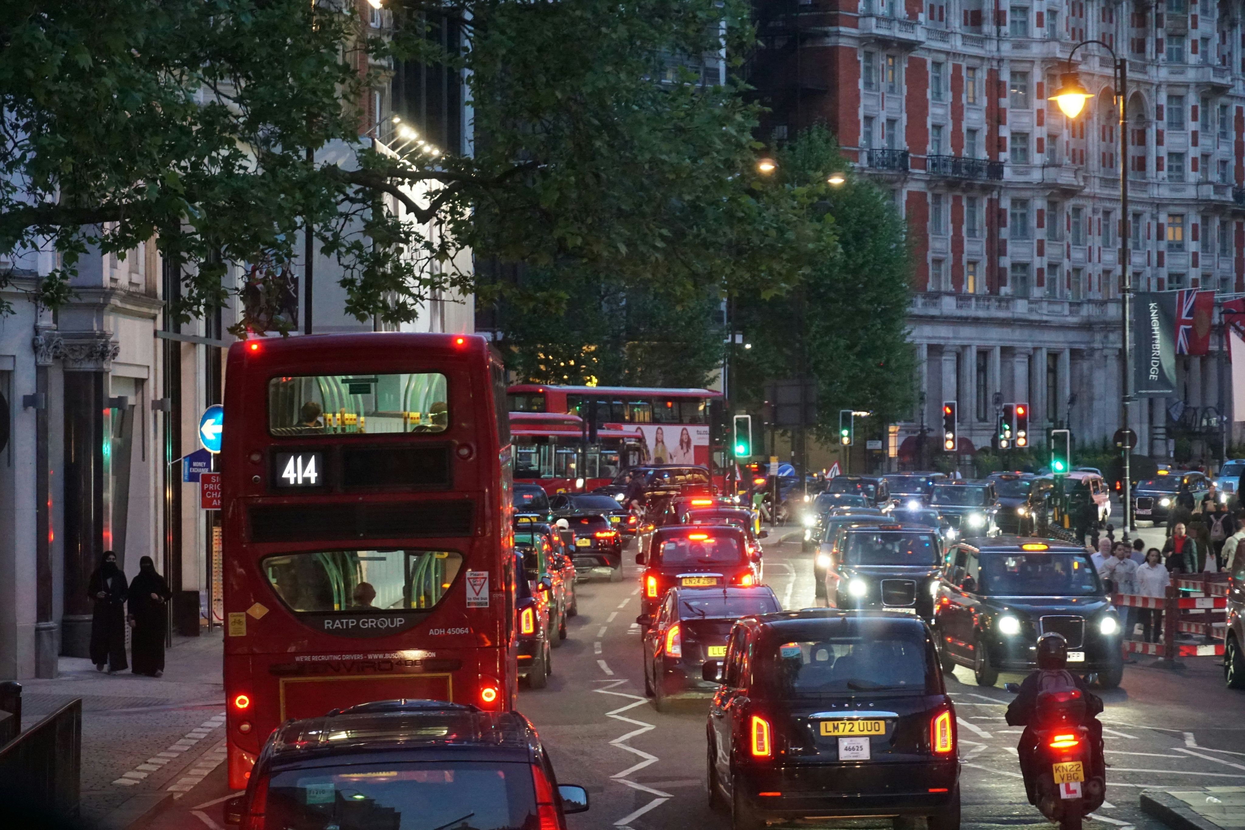 a busy city street filled with lots of traffic