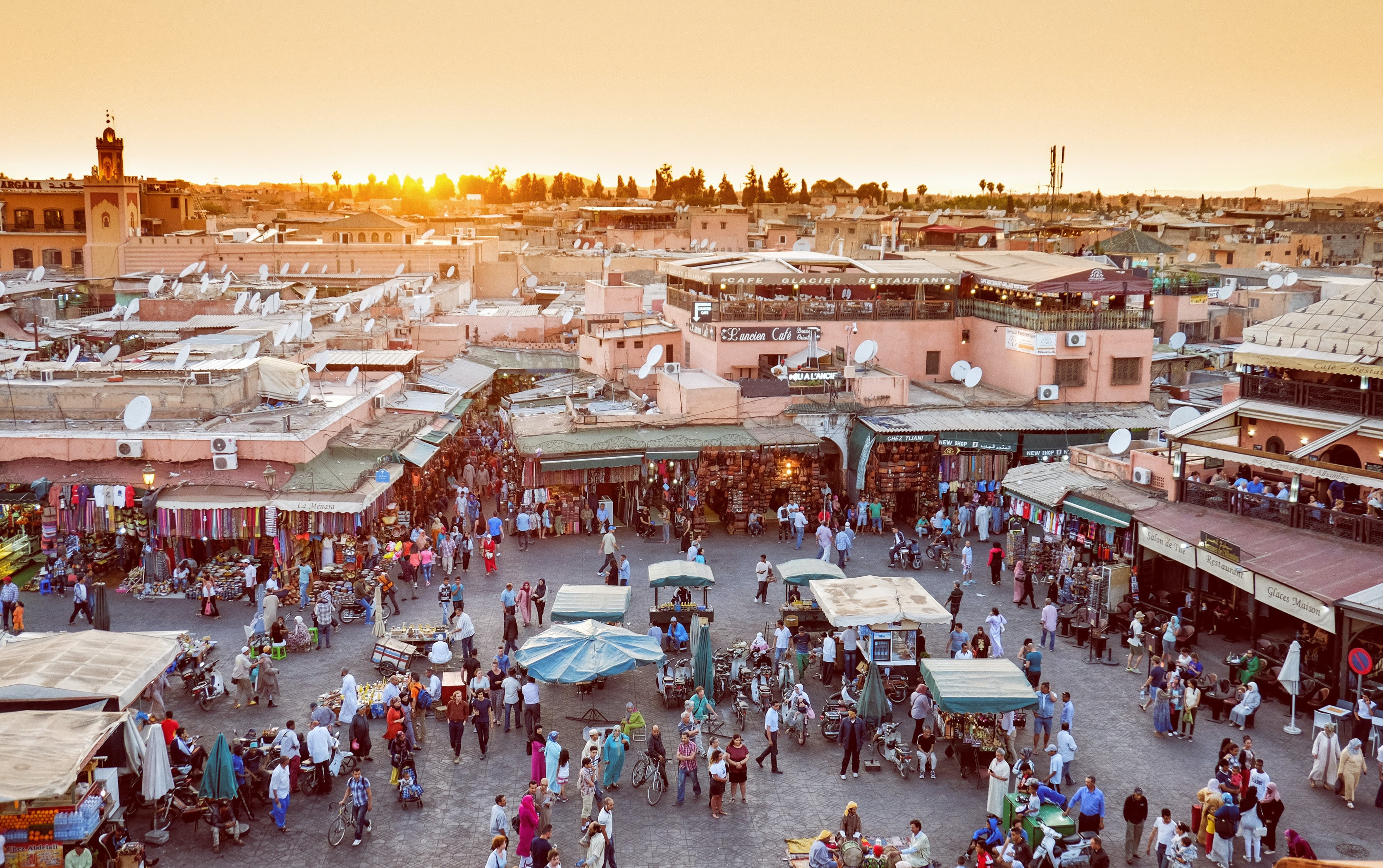 Aerial photograph of people in a busy outdoor market in Marrakesh