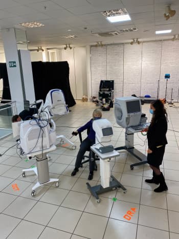 Patient and staff using medical equipment